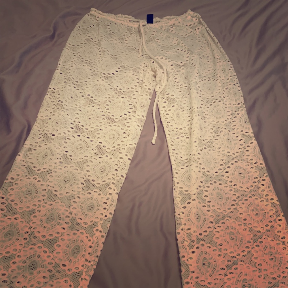 Lace bathing suit cover pants.